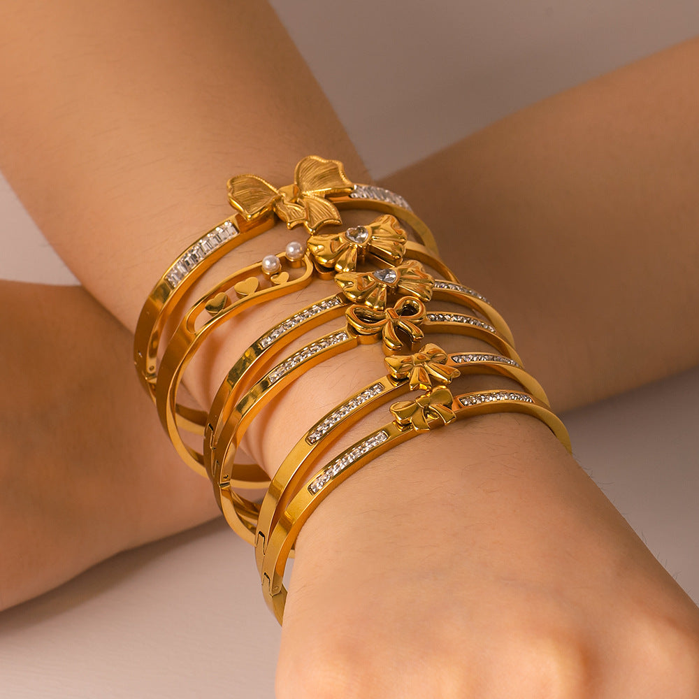 Asymmetrical Bow-Shaped Stainless Steel Bracelet for Women with Zircon Inlay and 18K Gold Plating