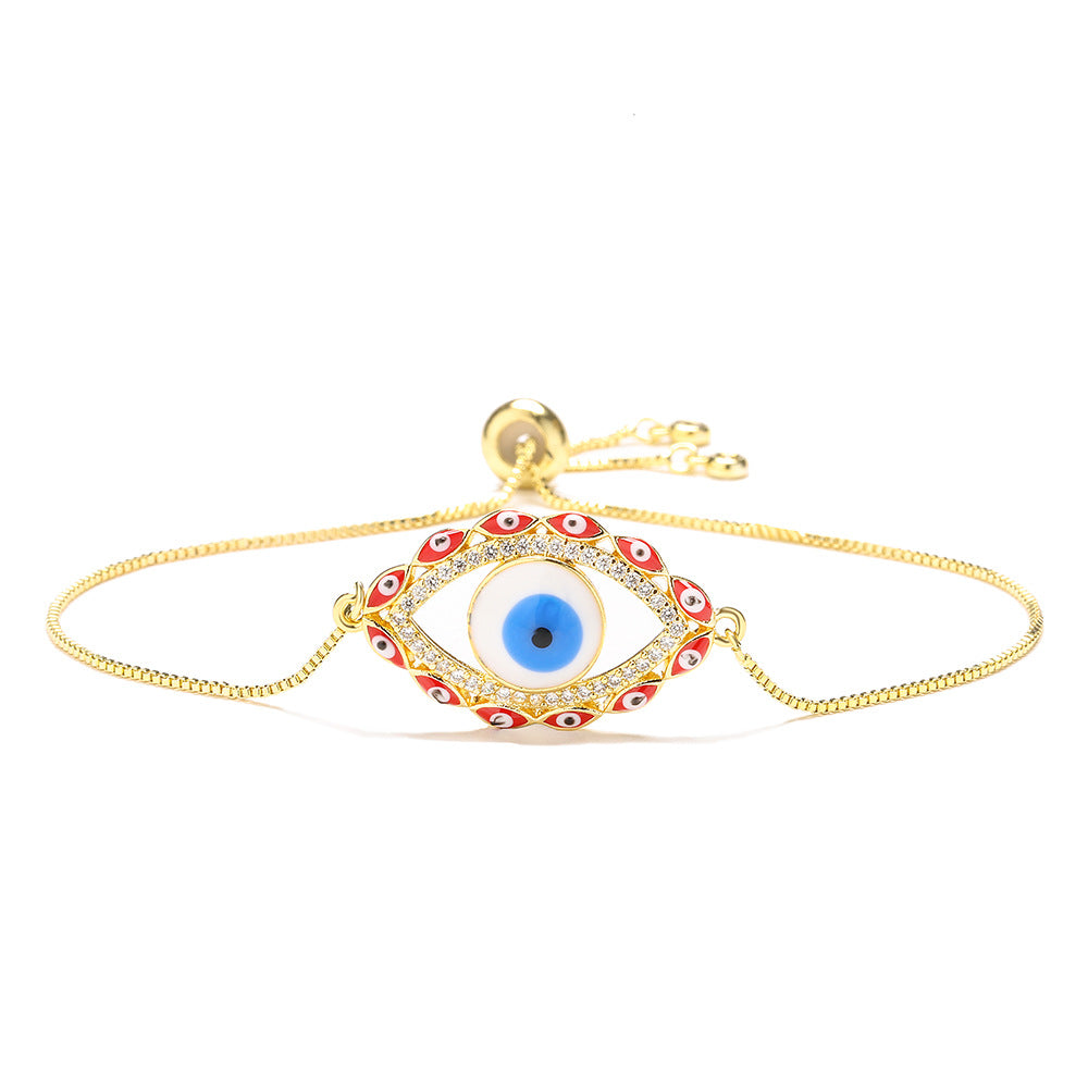 Bracciale da donna stile bohémien con charm a forma di occhio di Nazar, base in rame placcata in vero oro e intarsio di zirconi
