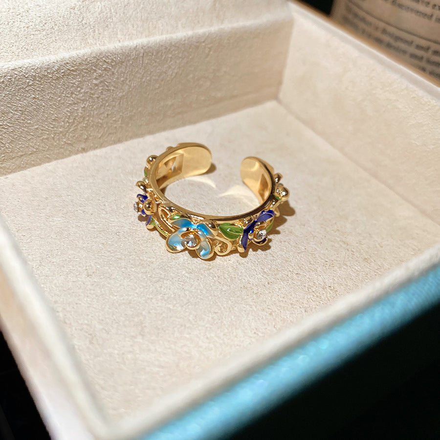 Anello floreale elegante con finitura smaltata e intarsio di strass da donna, fascia per l'indice di alta moda ispirata al vintage