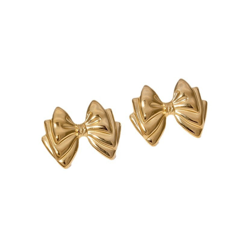 Orecchini da donna in acciaio inossidabile placcati oro a forma di fiocco, dallo stile dolce, fresco e minimalista