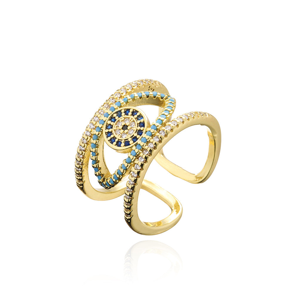 Anello Minimalista Geometrico a Occhio di Allah Traforato per Donna con Base in Rame e Placcatura in Oro con Zirconi Micro-Incastonati