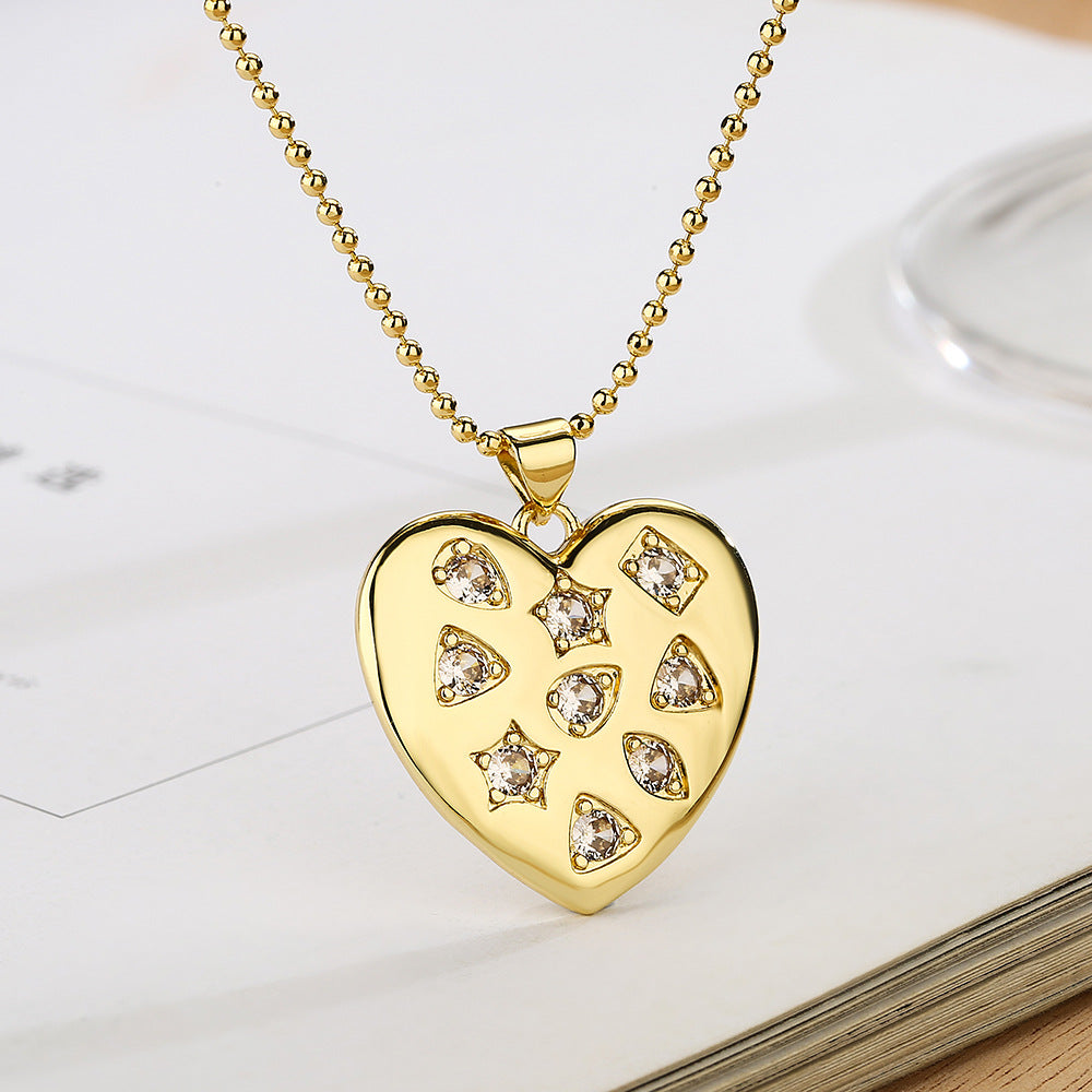 Collana con ciondolo a cuore e fiocco di neve minimalista da donna in rame con placcatura in oro vero e intarsio in zirconi