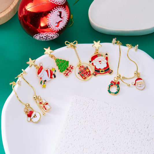 Pendientes de aleación con diseño de estrella asimétrica y Papá Noel, con esmalte para mujer