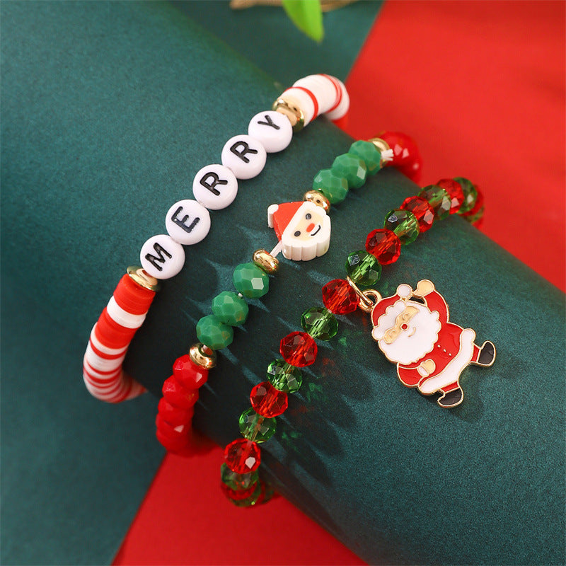 Set di bracciali natalizi fatti a mano in argilla polimerica da donna con ciondoli di Babbo Natale e fiocchi di neve in stile cartone animato giocoso