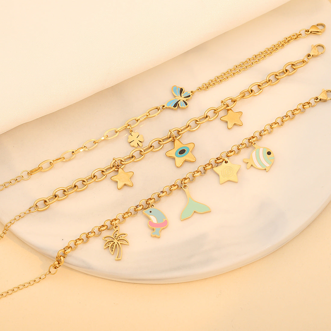 Bracciale da donna in acciaio inossidabile con farfalla e stella smaltate, motivi delfino e pesce