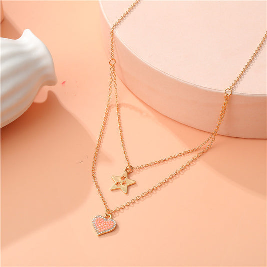 Elegante collana a forma di cuore e stella in lega per bambini con finitura smaltata e design a catena incrociata multistrato