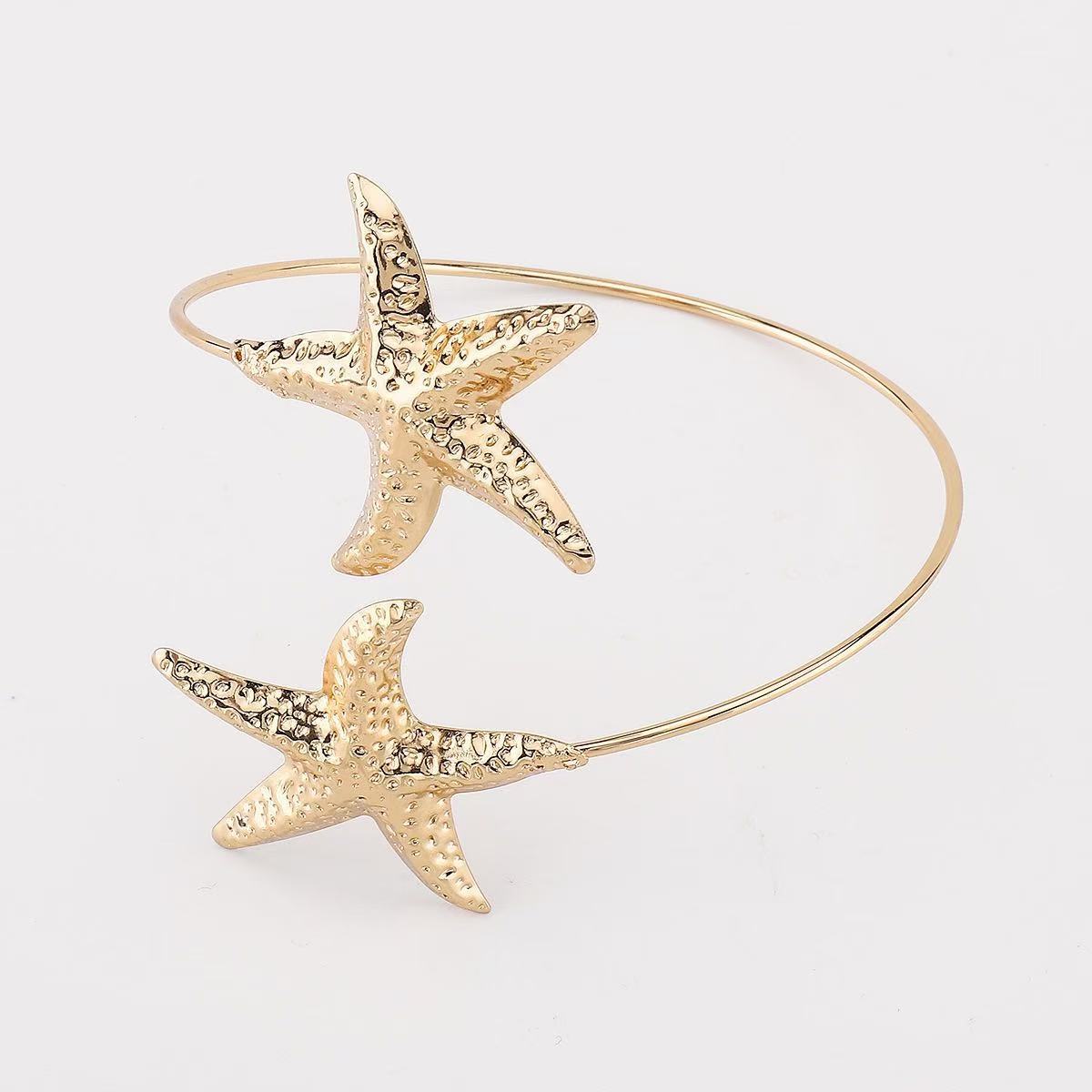 Bracciale Aperto in Lega Testurizzata a Stella Marina da Donna