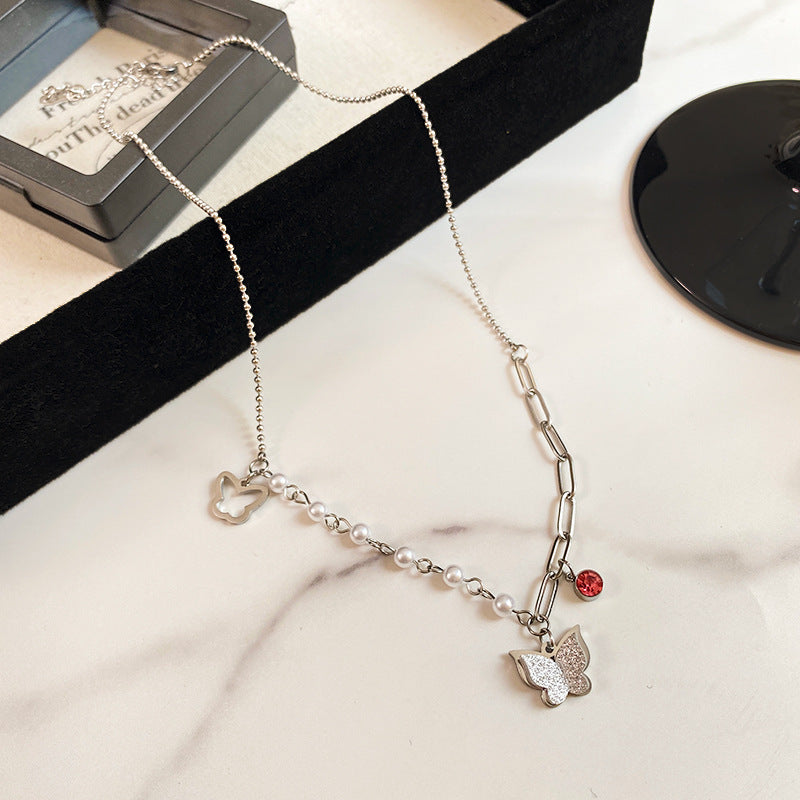 Minimalist Matte Butterfly Titanium Steel Necklace with Pearl and Red Rhinestone Asymmetric Design for Unisex