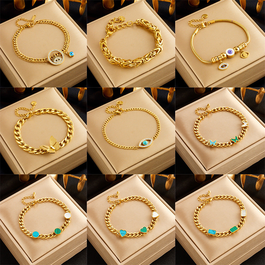 Bracciale alla moda minimalista in acciaio al titanio con ciondoli a cuore e farfalla e intarsio di strass, per donne