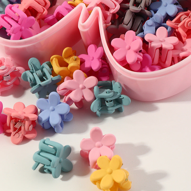 Fermaglio per capelli in plastica a forma di fiore per bambini con finitura smaltata in colori caramella