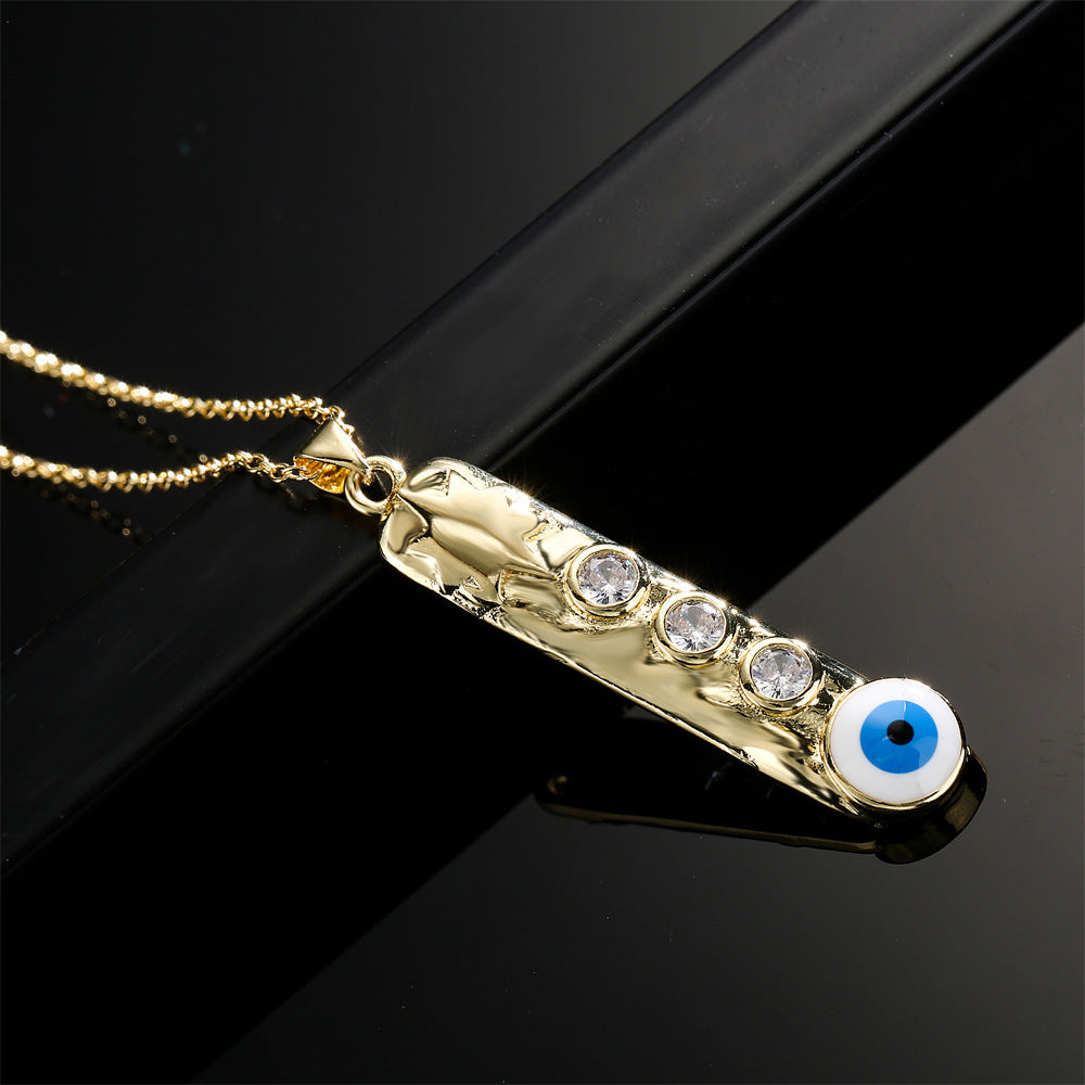 Collana con ciondolo a barra verticale geometrica con base in rame e placcatura in vero oro, design smaltato a occhio turco