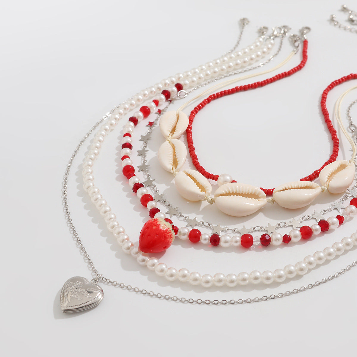 Set di collana da donna con conchiglie e perle a tema boho da spiaggia con ciondolo a cuore
