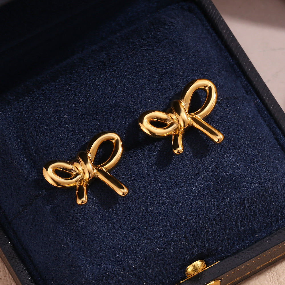 Orecchini da donna minimalisti vintage a forma di fiocco in acciaio inossidabile placcato oro 18 carati