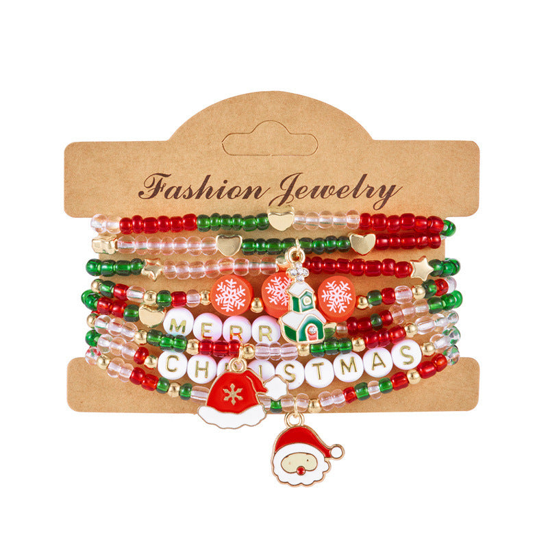 Pulsera minimalista con temática navideña con diseño de Papá Noel, bastón, muñeco de nieve, cuentas con letras y dije de aleación