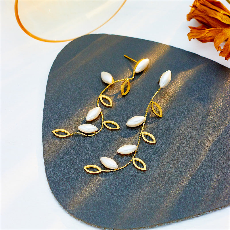 Minimalist Elegant Pearl-Embellished Hollow Leaf Dangle Stud Earrings in Titanium Steel with Plated Finish