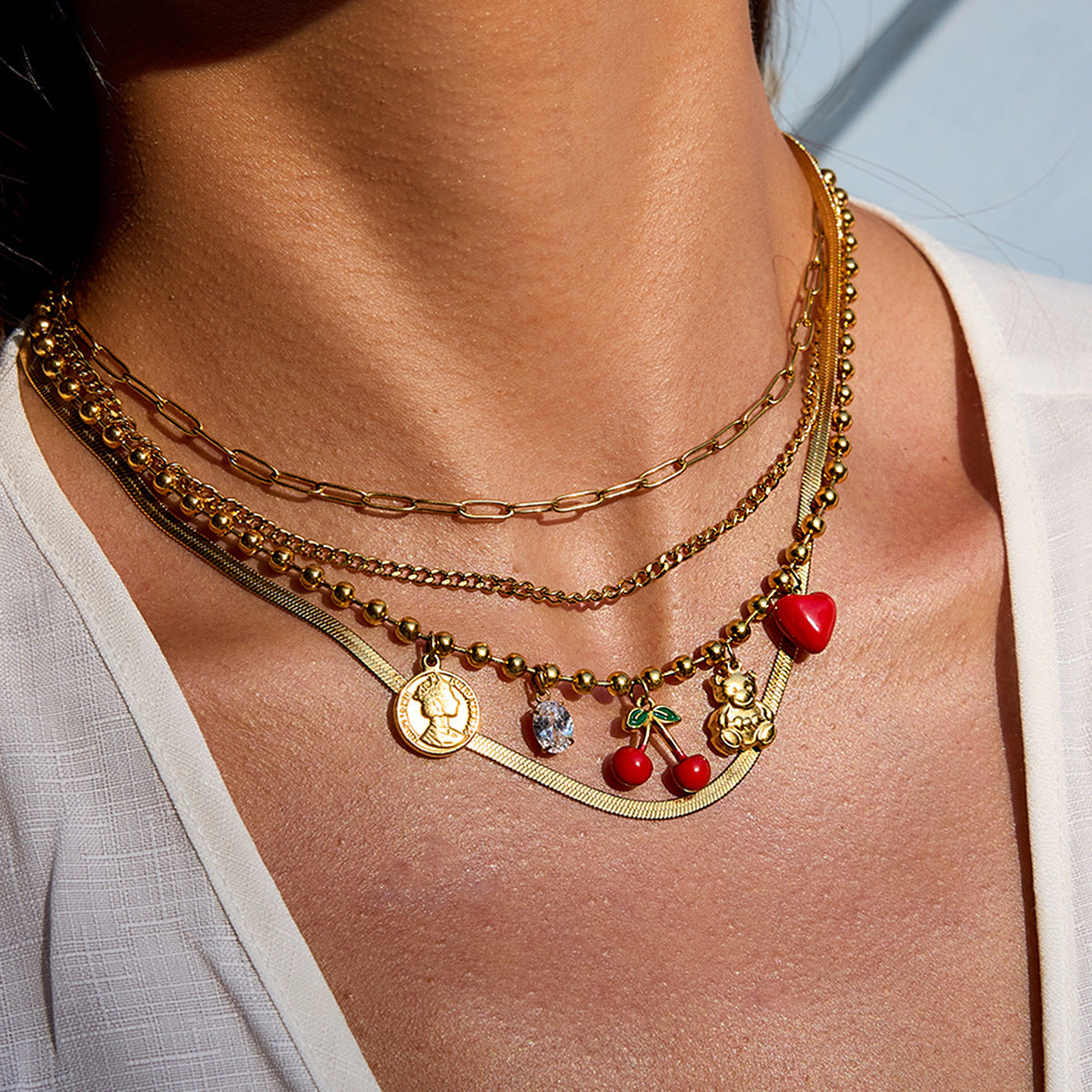 Collana minimalista in acciaio inossidabile a forma di ciliegia con intarsio di zirconi per donna, catena a clavicola multistrato in acciaio al titanio placcato