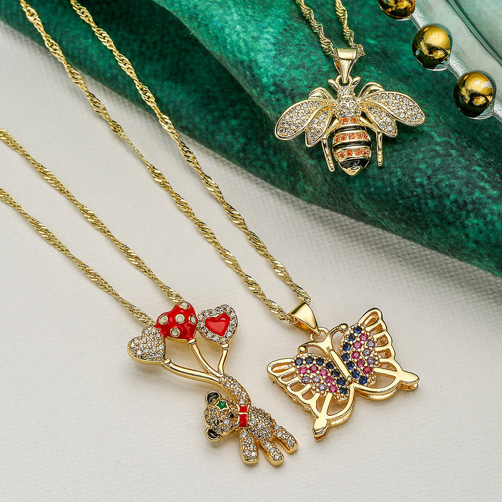 Collana con ciondolo a tema animale per donna, con base in rame e intarsio in zirconi cubici a forma di orso, farfalla e ape