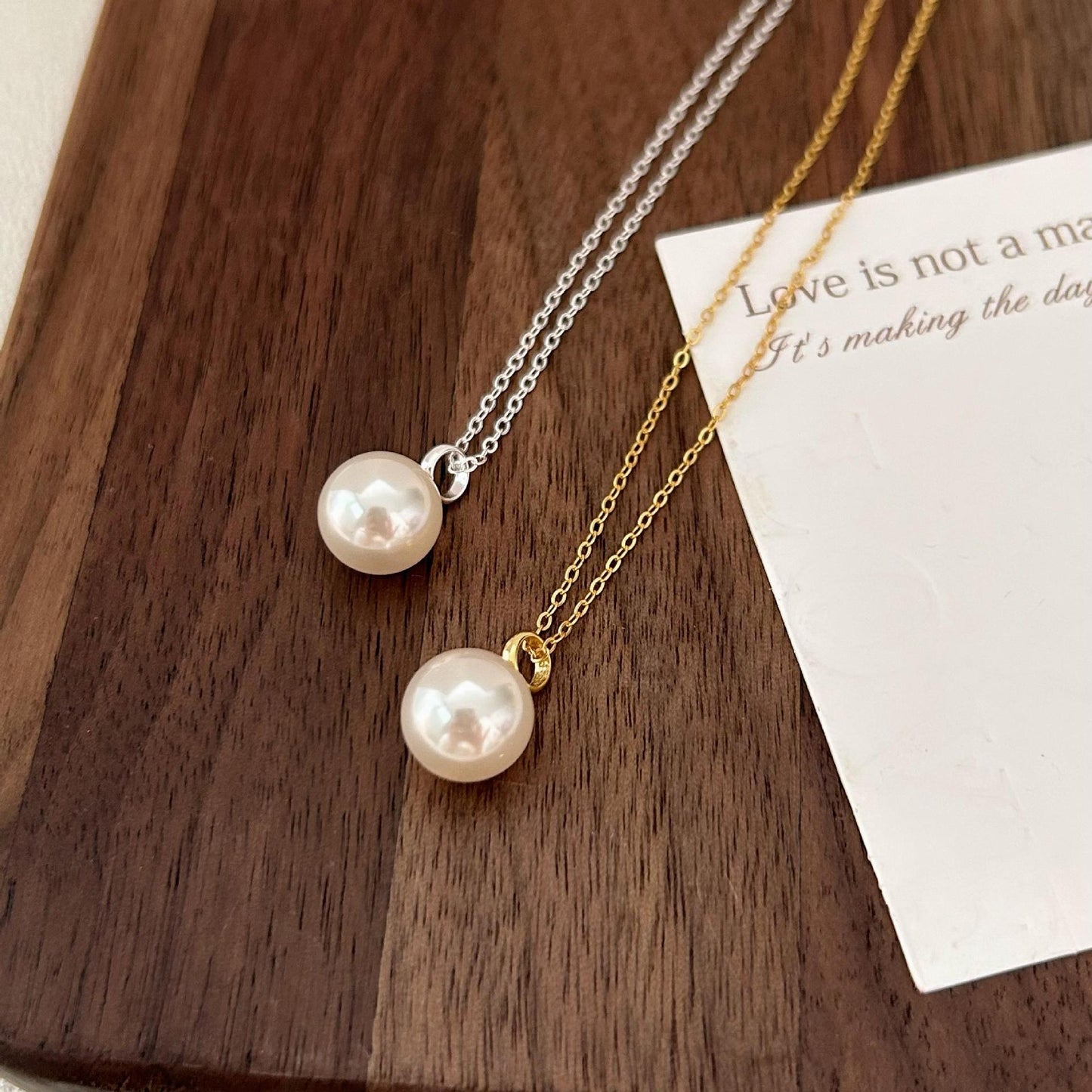 Minimalist Geometric Pearl Necklace in 925 Sterling Silver with Gold Plating on Cross Chain