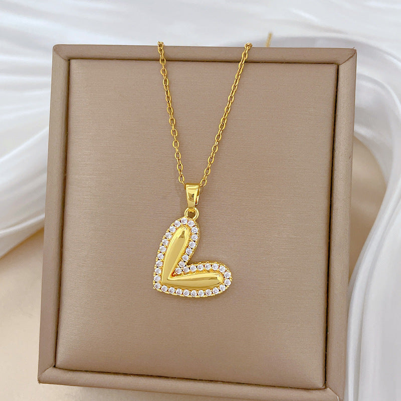 Collana minimalista da donna in acciaio al titanio a forma di cuore, con finitura lucida e intarsio di strass