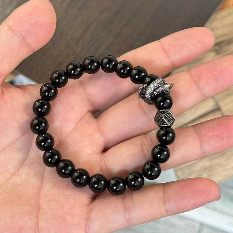 Bracciale Geometrico con Perline di Ossidiana Nera, Montatura in Rame e Accenti di Zirconi, Accessorio Moda Unisex per Donna e Uomo