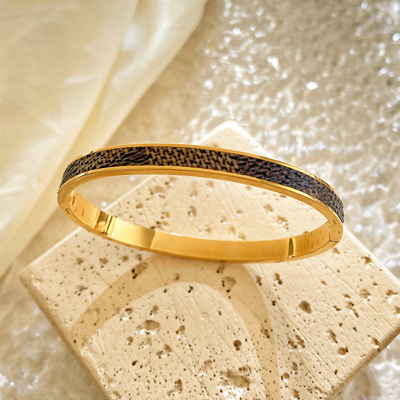 Minimalist Titanium Steel Plated Bracelet with Black Leather Texture