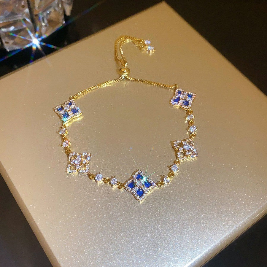 Elegante bracciale da donna con fiore geometrico e accenti in zircone, in rame placcato, stile trendy da ufficio, gioiello versatile e lussuoso per la mano