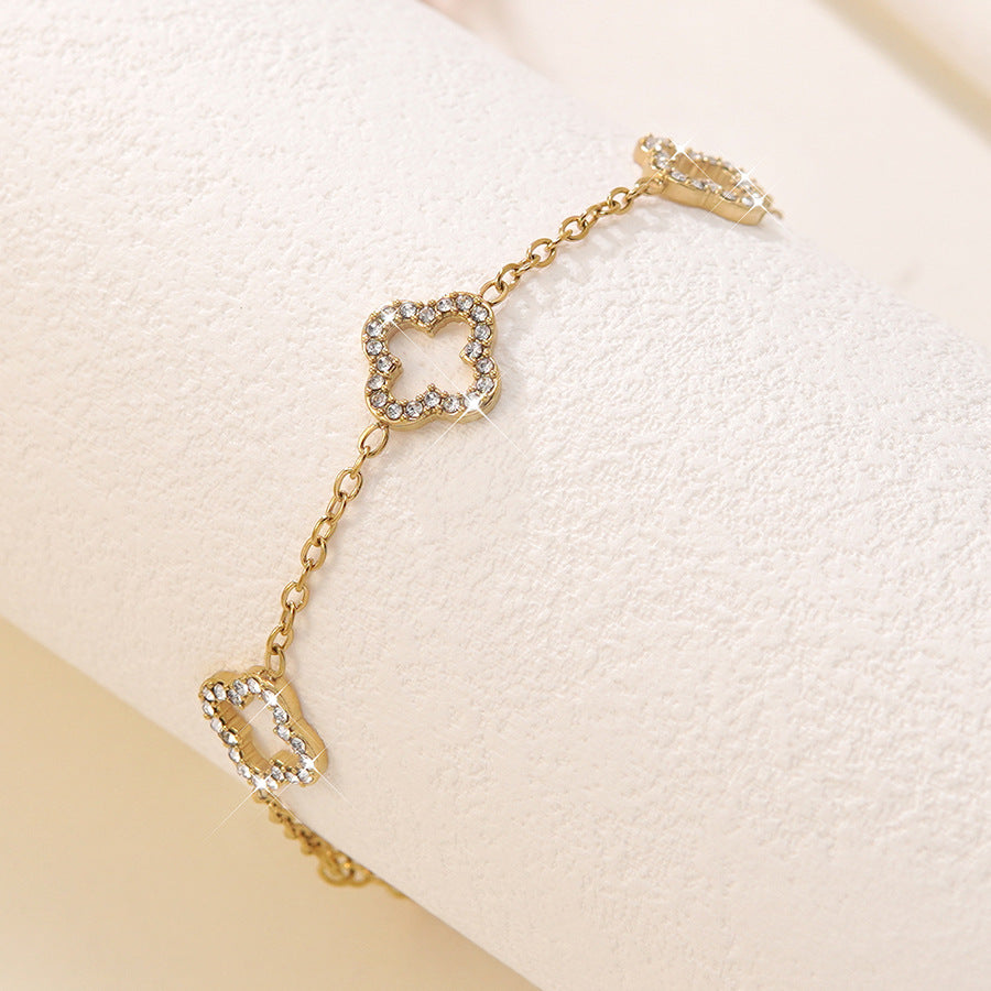 Elegante Bracciale Minimalista da Donna in Acciaio Inossidabile Placcato Oro con Zirconi e Quadrifoglio