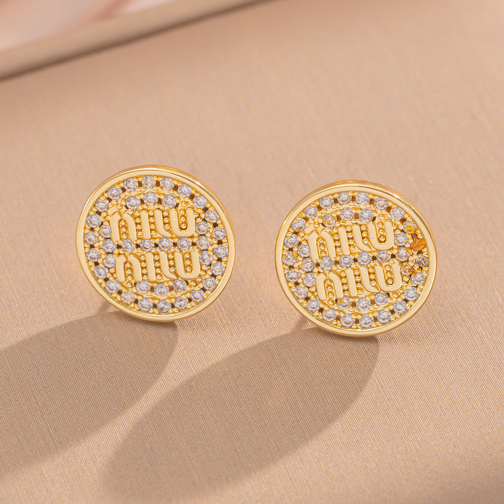 Orecchini a perno Saturno minimalisti color oro in ottone con zirconi per donna