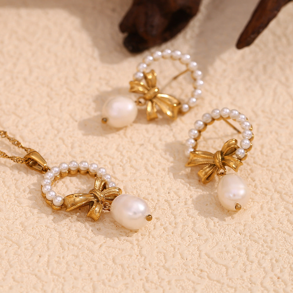 Vintage-Inspired Bow and Geometric Pendant Necklace for Women in Stainless Steel with 18K Gold Plating and Pearl Accents