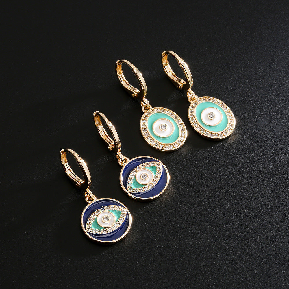 Orecchini geometrici in rame a forma di occhio con placcatura in oro 18 carati e accenti in zirconia smaltata colorata