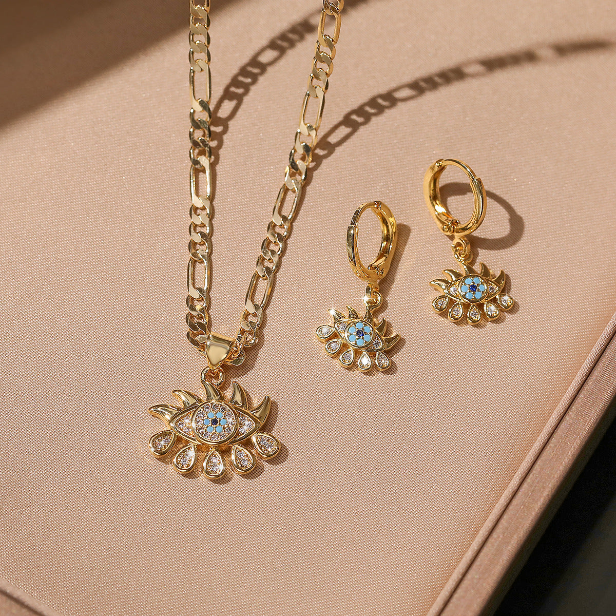 Parure minimalist con collana e orecchini malocchio in rame con zirconi e catenina a sfere