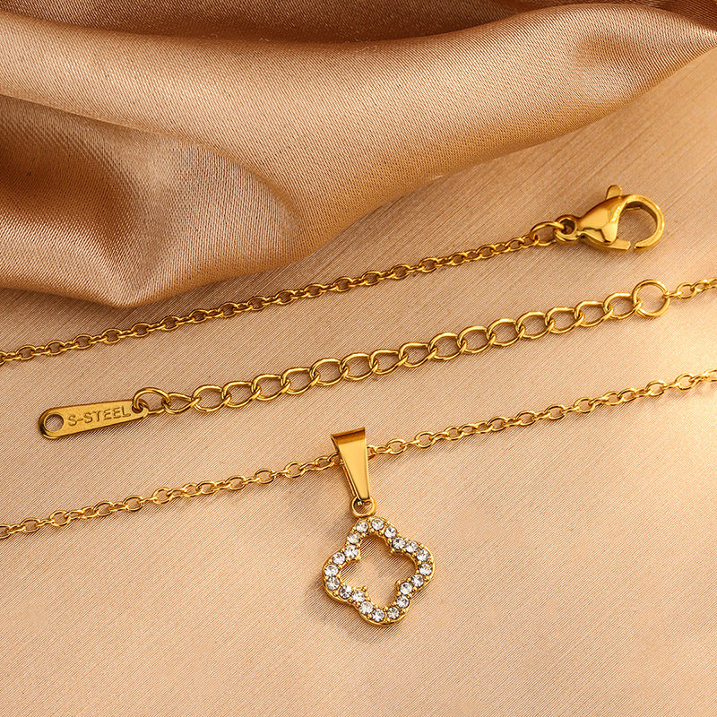 Elegante Juego de Collar de Acero Inoxidable con Trébol de Cuatro Hojas y Circonitas Cúbicas con Pulsera y Pendientes a Juego para Mujer
