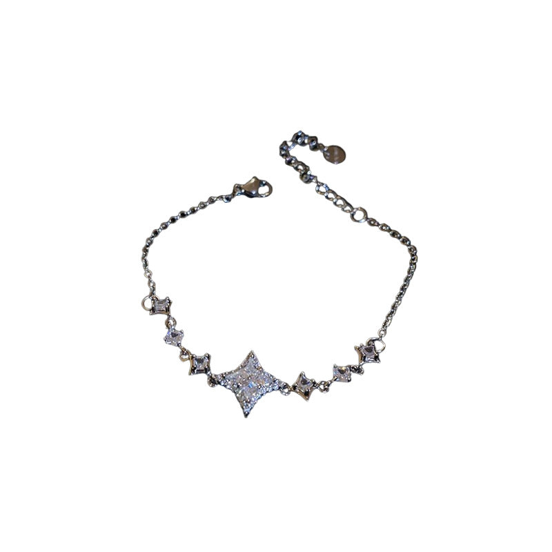 Elegante juego de collar y pulsera de cobre con forma de estrella con incrustaciones de circonita para mujer