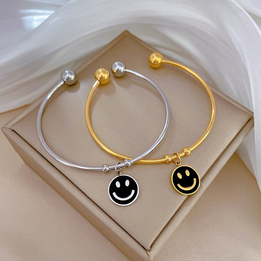 Bracciale Minimalista in Acciaio al Titanio con Faccina Sorridente in Madreperla e Finitura Placcata
