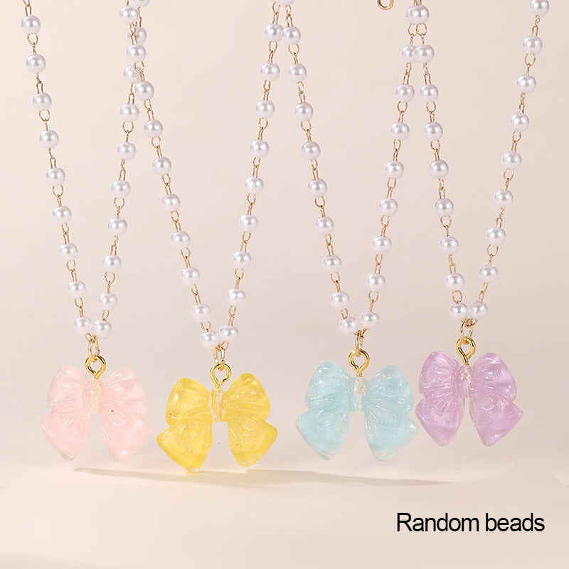 Conjunto de collar minimalista de lazo y corazón para niñas con colgante de resina en cadena de cuentas Colección de Verano