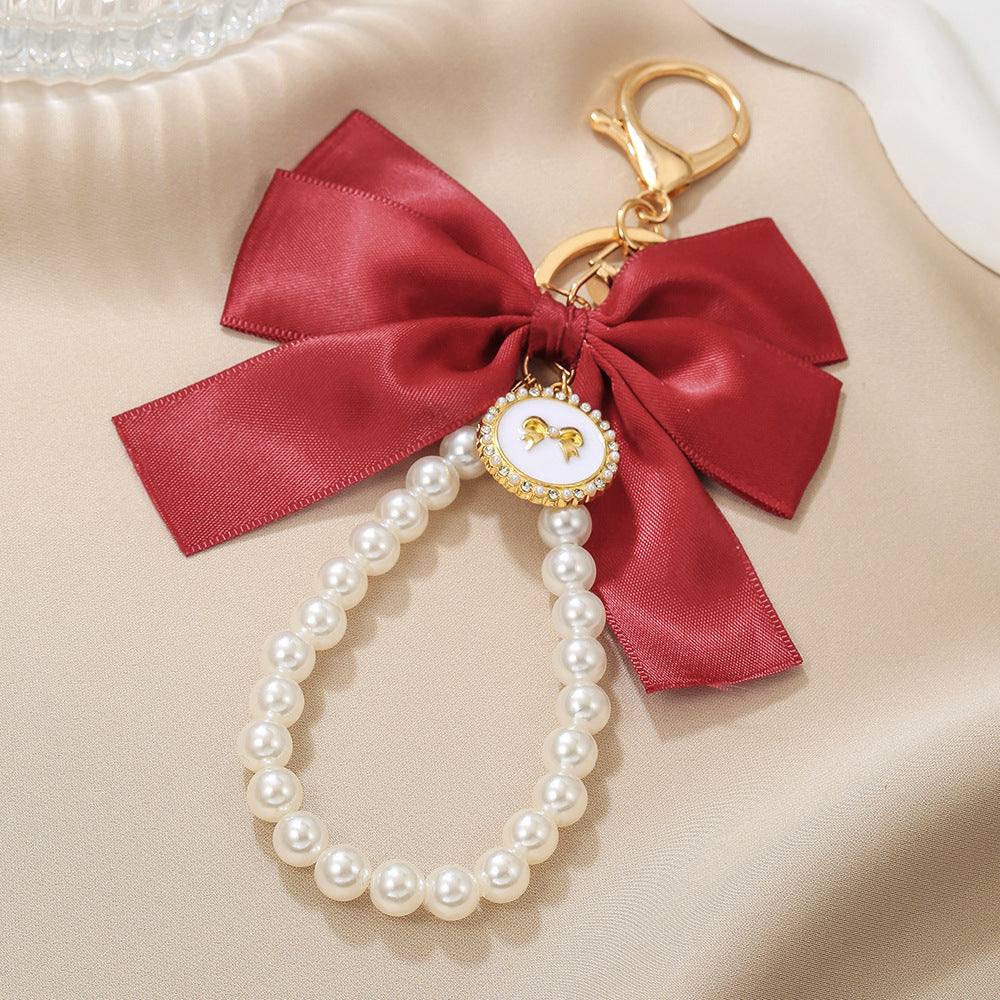 Sweet Cartoon Bow Pearl Zinc Alloy Keychain Bag Charm
