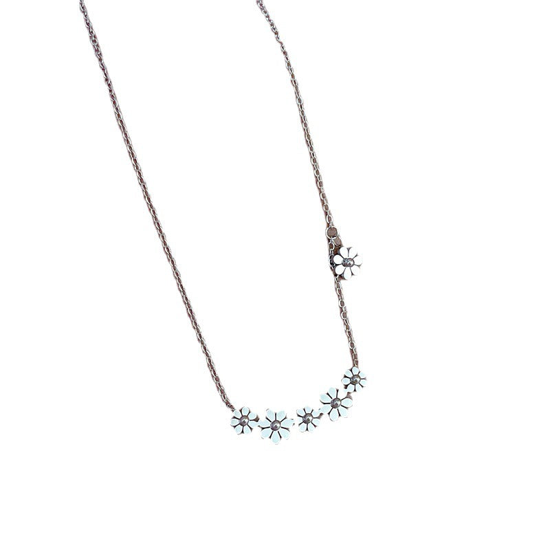 Collana girocollo minimalista in acciaio al titanio con motivo floreale