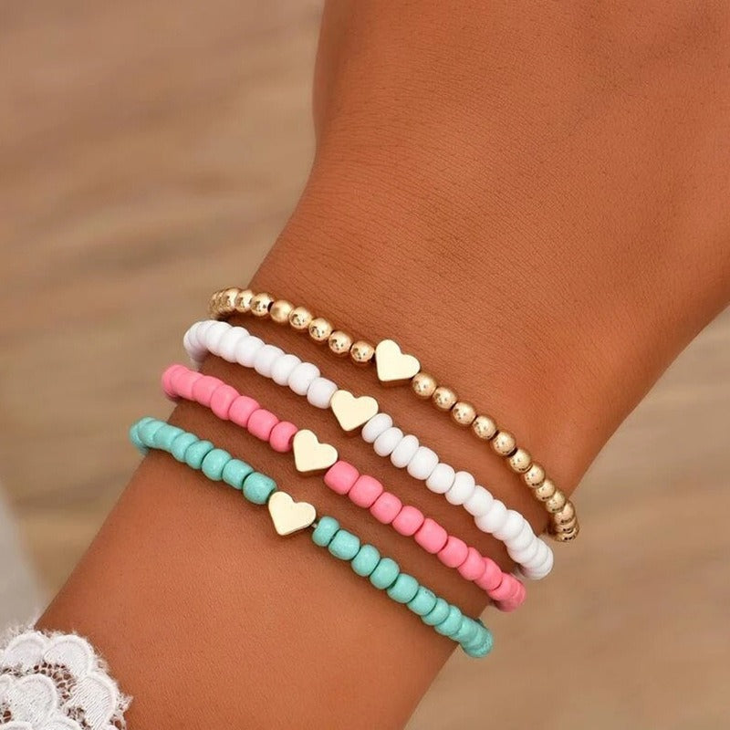 Pulsera elástica bohemia hecha a mano con abalorios, diseño geométrico y en forma de corazón, con cuentas de semillas de colores y acabado chapado