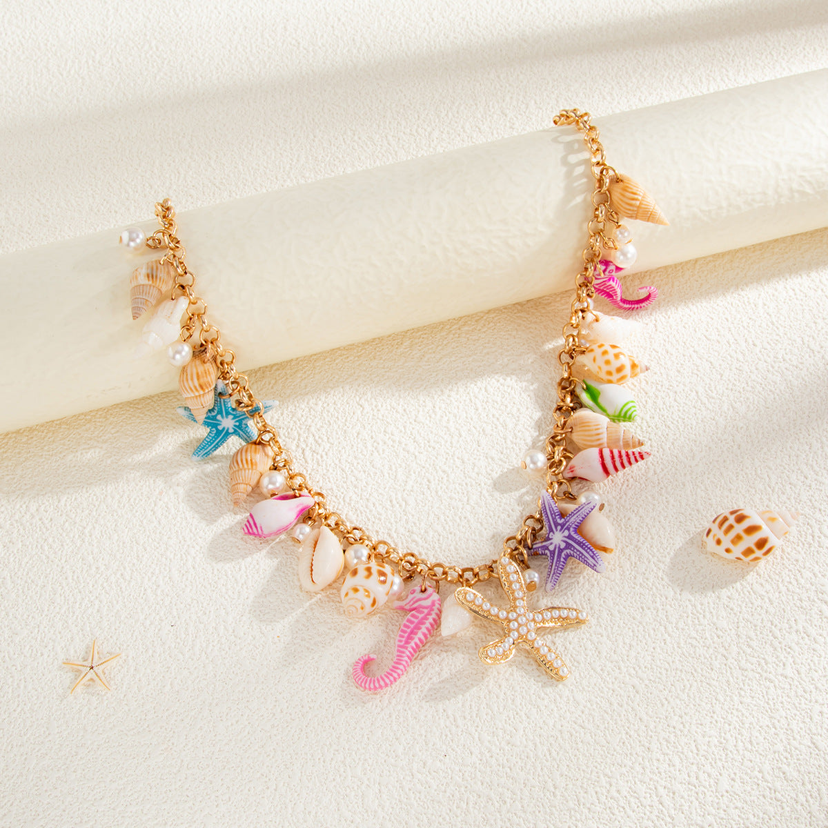 Catena da Corpo Bohemien con Stelle Marine, Conchiglie e Perle Imitazione per Donna, con Finitura in Metallo Lucido e Chiusura a Moschettone