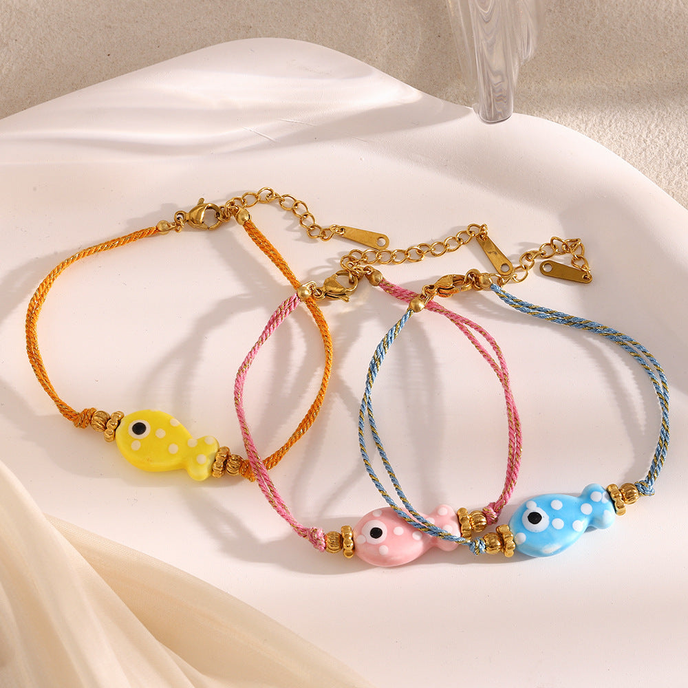 Bracciale da donna in corda intrecciata color oro, placcato in oro 18 carati, stile OL alla moda, a forma di pesce