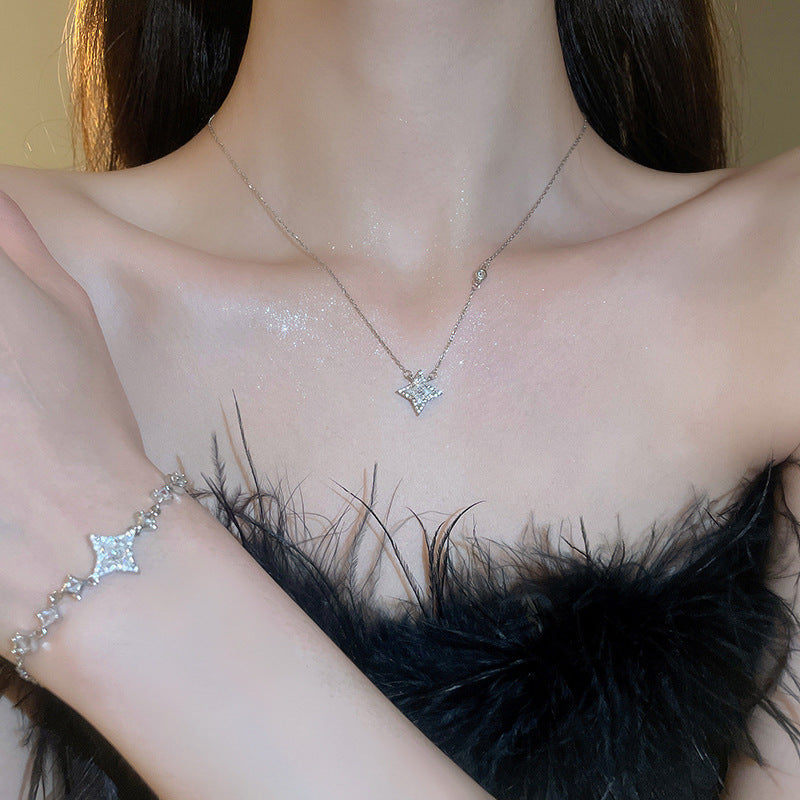 Elegante juego de collar y pulsera de cobre con forma de estrella con incrustaciones de circonita para mujer