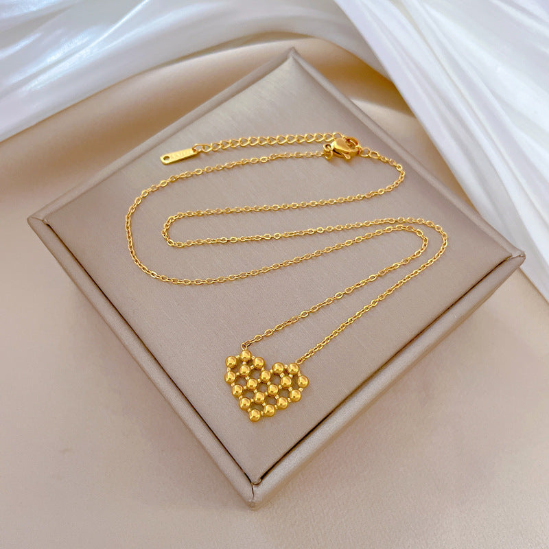 Minimalist Titanium Steel Hollow-Out Round Bead Heart Pendant Necklace for Women with Gold Plating and Geometric Design for Clavicle Styling