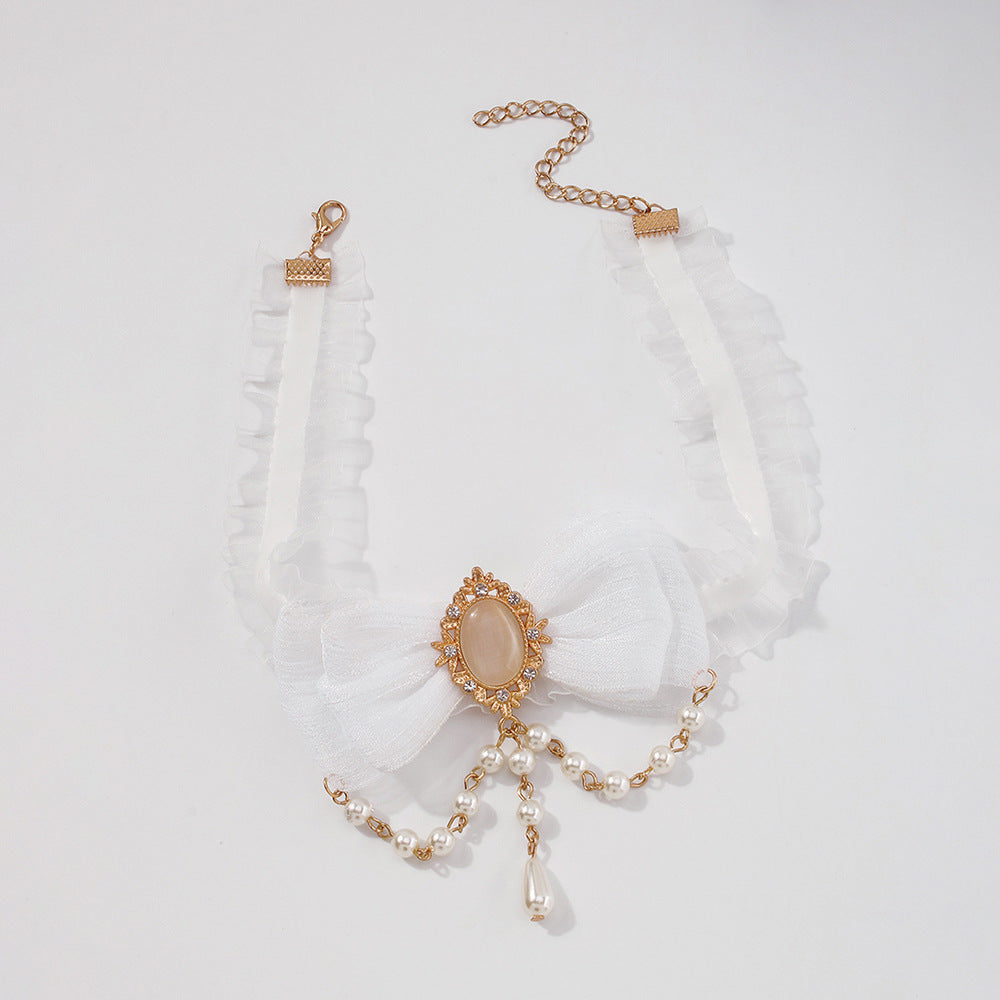 Collar de nudo de lazo geométrico dulce y atrevido con base de aleación, colgante de imitación de perla y detalles de estrella-luna para mujer
