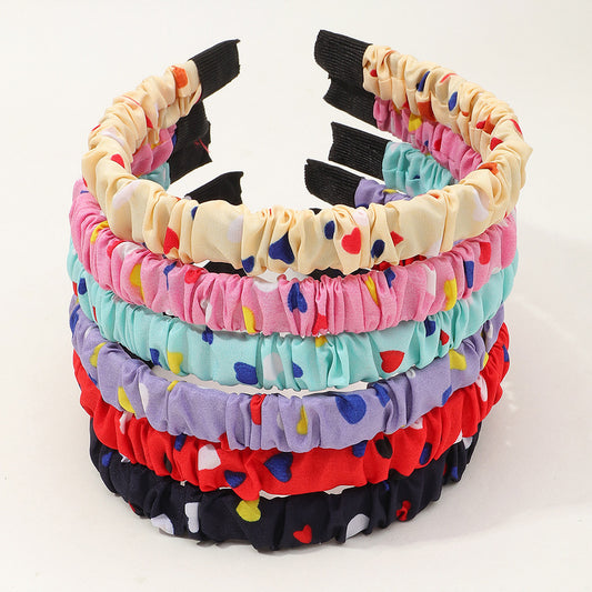 Bonita diadema de resina plástica con estampado de corazones para niños con acabado artesanal en forma geométrica