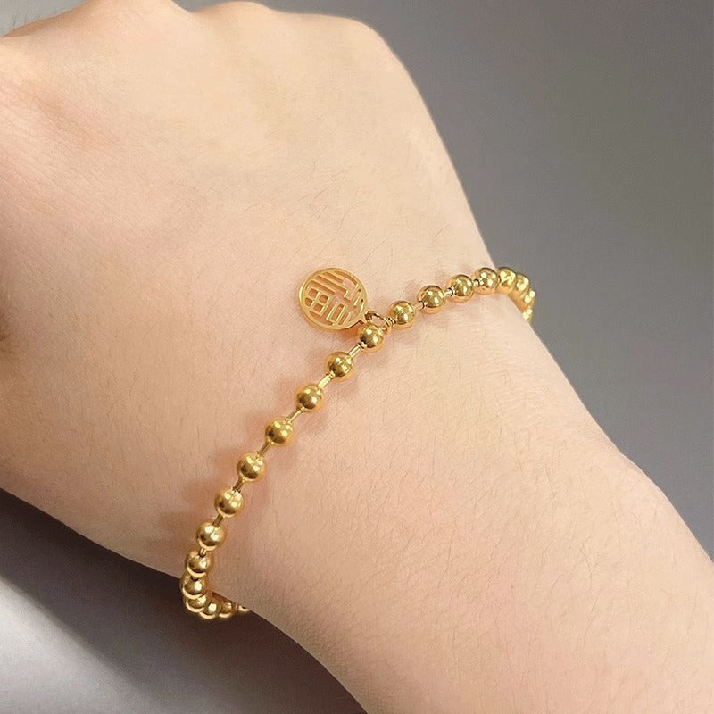 Original Design Leaf-Shaped Titanium Steel Bracelet with 18K Gold Plating for Women, Hypoallergenic Round Bead Wristband