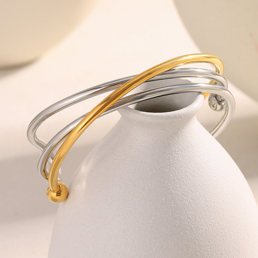 Bracciale da donna in acciaio inossidabile placcato oro 18 carati con design geometrico a linea incrociata, stile minimalista