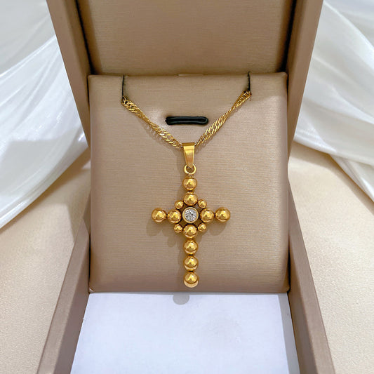 Collar con colgante de cruz de bola de acero de titanio minimalista con detalle floral chapado en oro