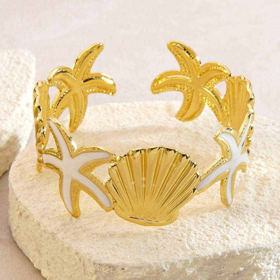 Bracciale a polsino in acciaio inossidabile con gocciolamento casuale, stella marina e conchiglia