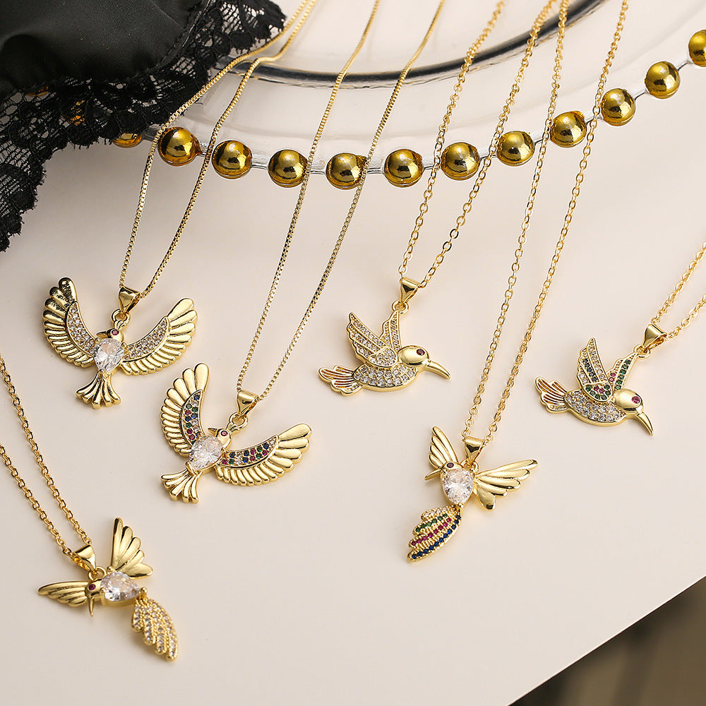 Collana con ciondolo a forma di uccello minimalista in rame placcato oro con zirconi per donna