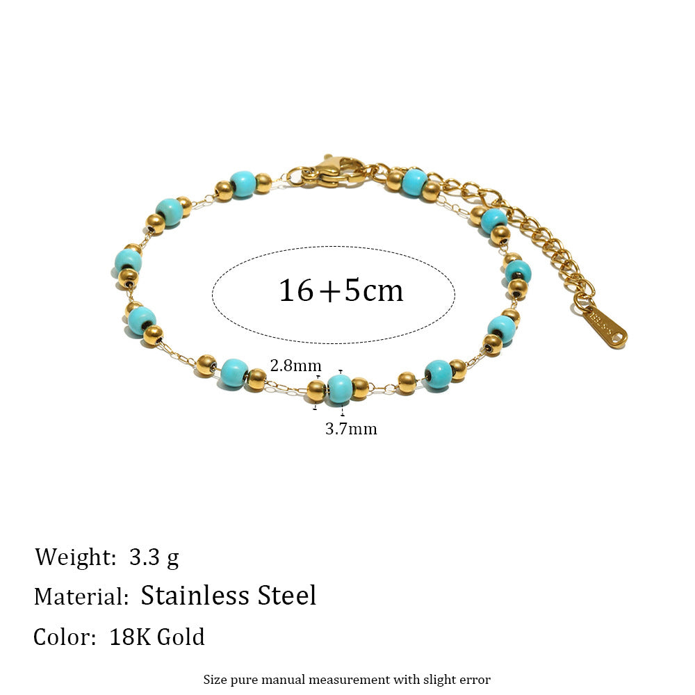 Pulsera minimalista de acero inoxidable con dije de margarita, detalles esmaltados y chapado en oro de 18 quilates para mujer